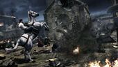 Ezio riding through a besieged Monteriggioni.