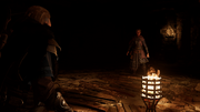 Fulke confronted by Eivor in the underground catacomb