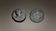 A bronze coin dated from 35 to 31 BCE, showing Kastor and Polydeukes obverse