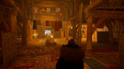Eivor searching for Cynon in the longhouse
