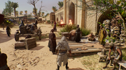 Basim finding a group of stranded merchants near the main gate