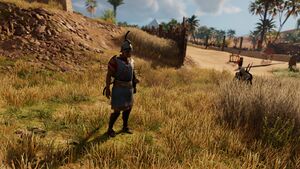 ACO Bayek ambushing Ptolemaic army soldier.jpg