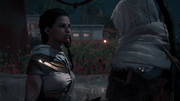 Bayek explaining the situation to Aya.