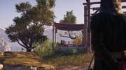 A figure watches Kassandra's family from afar