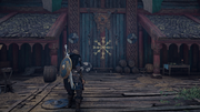 Eivor finding a rune of power displayed on her clan's longhouse