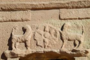 Two lions confronting a rosette on the facade of a tomb at AlBanat Mountain.