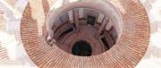 Bayek finding an opening into the tomb
