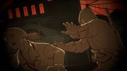 Orelov shoving Anastasia out of the way