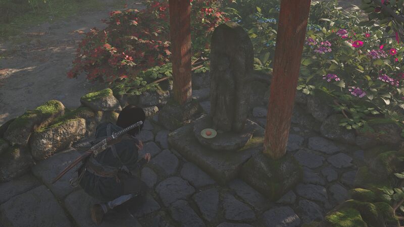 File:ACSH Naoe making offering at a Jizo Statue.jpg