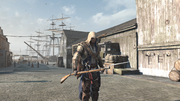 Connor holding a musket