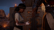 Nefertari given a charm of Anubis by Bayek