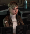 Lucy sitting at a computer in the Sanctuary.