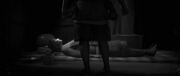 Junjiro with a knife in his hand, waiting to kill Naoe in her sleep