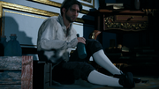 Arno drunk in the library after the Assassins expelled him