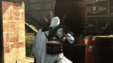 Ezio lighting a fuse, attached to the barrels.