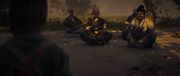 The monks meditating while waiting for Naoe