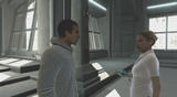 Lucy talking to Desmond at Abstergo's Laboratory.