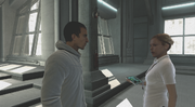 Lucy talking to Desmond Miles at the Abstergo laboratory