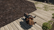 Aveline taking the letter from the body