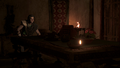 Kassandra, alone at the dinner table