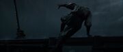 Yasuke escaping while being shot in the back by Caro