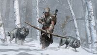 Ratonhnhaké:ton with two wolves.