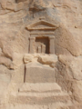 An unfinished Nabataean niche sheltering a betyl carved in Hegra.