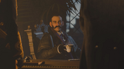 Crawford Starrick drinking a cup of tea