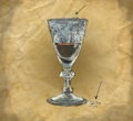 The victim's wine glass, with the powdery residue found along the rim.