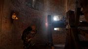 Eivor shooting the mechanism to remove the blockade